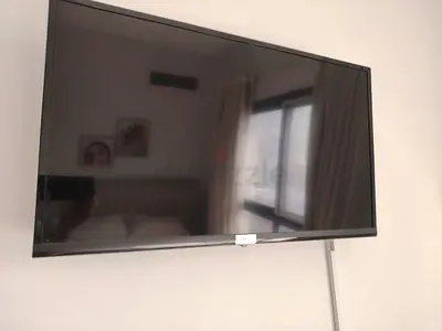 42-55 Wall-mounted LED TV in good condition