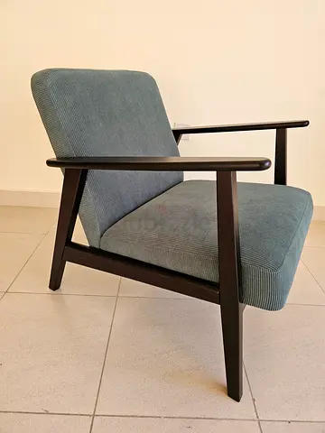 Modern upholstered dining chair with dark wooden legs - used few times