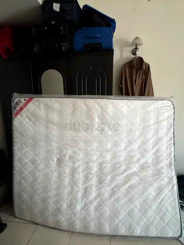 Queen-size mattress in good used condition (with cover)