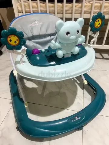 Light blue baby walker with seat and activity toys - good condition