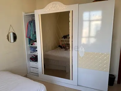 White mirrored sliding wardrobe with storage - good condition with two beds 120cm with mattress
