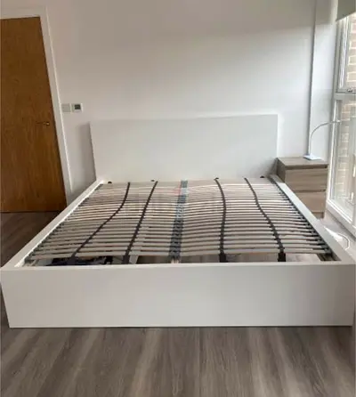 ikea malm king bed with ikea firm mattress   having 2 storage units under the bed