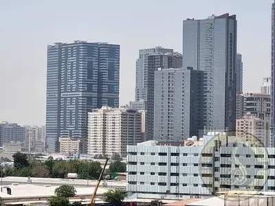 STUDIO APARTMENTS SAPRATE KITCHEN BATH STARTING FROM 28K,30K,1 CHEQ,32K 34K 4 / 6 CHEQS + 1 MONTH FREE ON DUBAI SHARJAH BORDER ON RTA BUS STOP F 24 CO