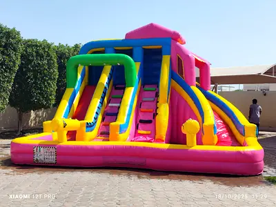 Large Pink Inflatable Bouncy Castle with Double Slides - Good Condition