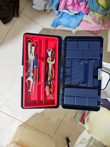Small mechanics tool kit with wrenches and screwdrivers in carry case