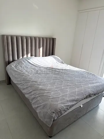 Queen upholstered bed with padded headboard - light grey
