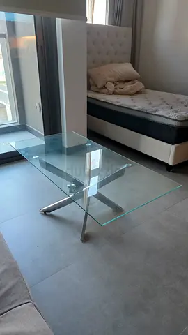 Glass coffee table with stainless steel base - good condition