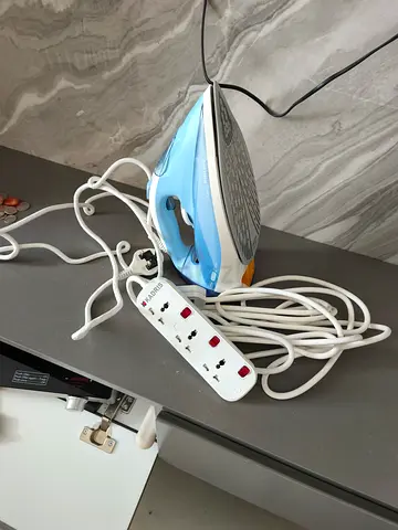 Lightweight Steam Iron in Good Working Condition and Socket extension