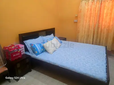 Queen wooden bed frame with mattress and side tables