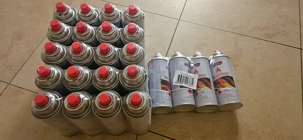 Lot of small portable gas canisters (butane/propane cartridges) - unused