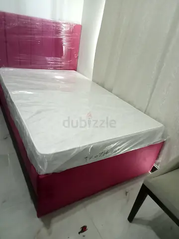 120,190 pink upholstered bed with mattress - like new