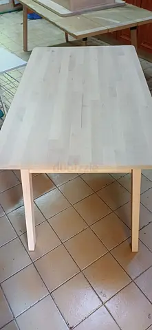 Solid light wood dining table - good condition
