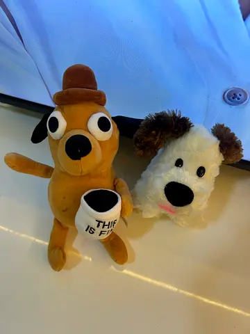 Two plush dog toys - small stuffed animals, good condition