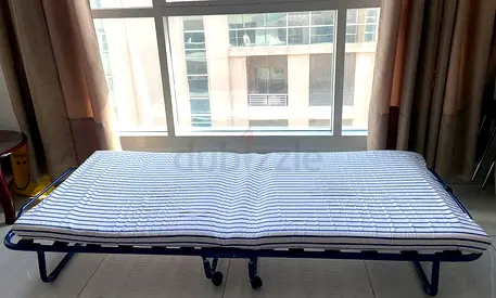 Foldable single guest bed with mattress - good condition