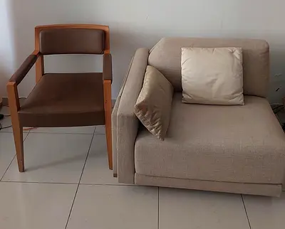 Beige single-seater sofa and wooden armchair - good condition