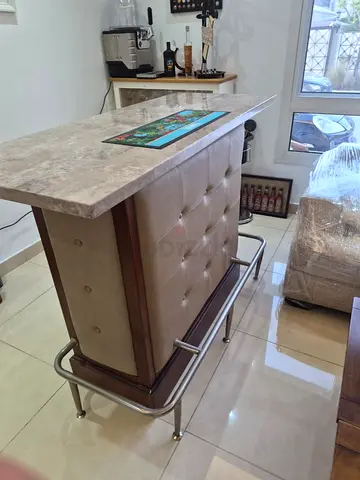 Compact upholstered home bar counter with marble top and footrest