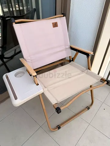 Beige deck chairs with tables