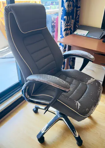 Used ergonomic office chair with worn faux leather - needs reupholstery