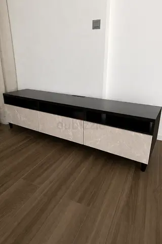 Modern low TV cabinet with marble-effect drawers