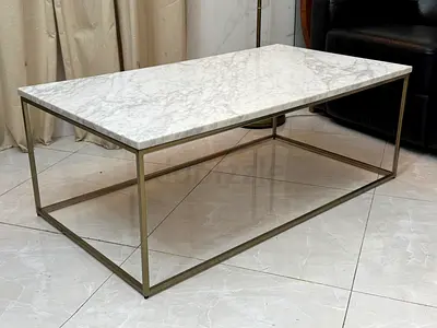 West Elm marble-top coffee table with a gold-finished metal frame
