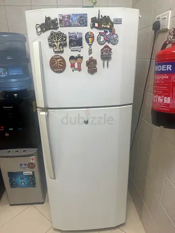 White two-door refrigerator (top freezer) - good working condition