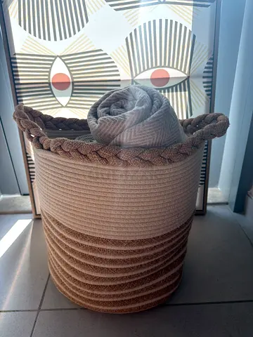 Large woven rope storage basket with braided handles