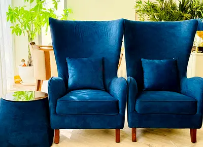 Pair of Blue Velvet Wingback Accent Chairs with Side Ottoman