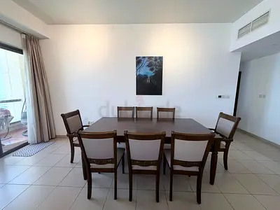 Solid Wood 8-Seater Dining Table with Upholstered Chairs - Good Condition
