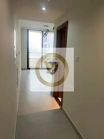 Apartment for annual rent in Al-Jada, first occupancy, elegant decor, new tower, spacious areas, open view with balcony, free maintenance, central air