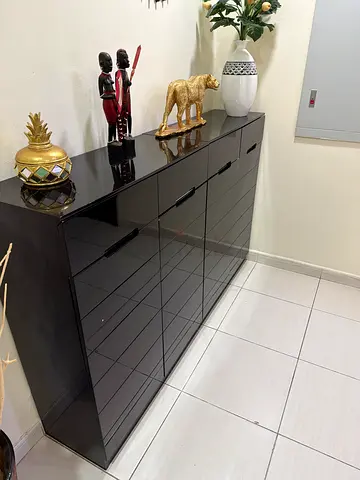 Low glossy black shoe cabinet with drawers