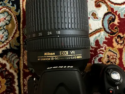 Nikon DSLR with charger and sling camera bag - used