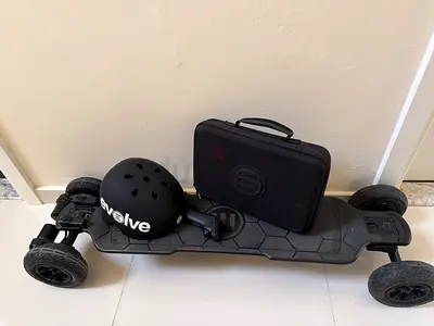 Evolve All-Terrain Electric Skateboard with Helmet and Travel Case