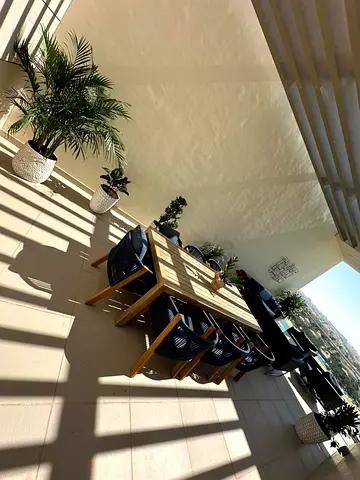 Outdoor wooden dining table set with 8 chairs - good condition