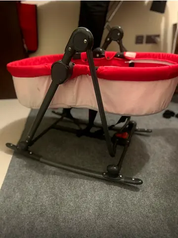 Foldable baby bassinet/rocker in red and cream - good condition