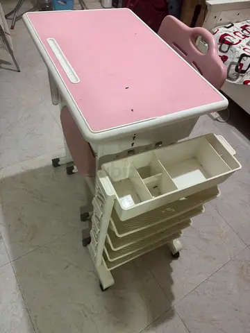 Pink adjustable kids study desk with storage drawers