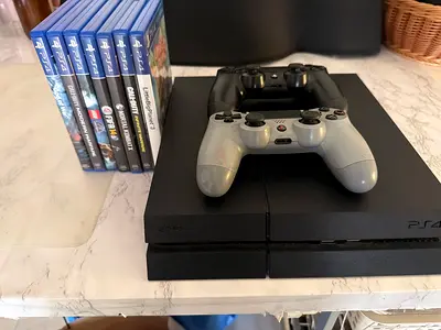 PS4 with 2 Controllers and 7 Games - Good Working Condition - Games or PS4 can be sold seperately