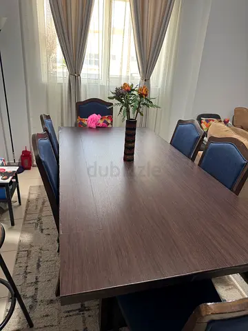 Solid dark wood dining table with 6 chairs - good condition