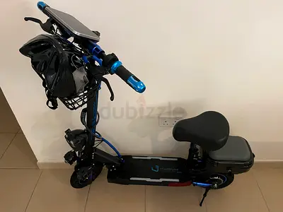 Electric scooter with seat and storage box - used, good condition