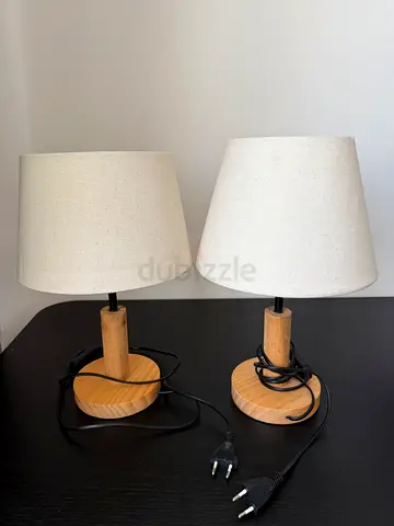 Pair of wooden base table lamps with cream fabric shades