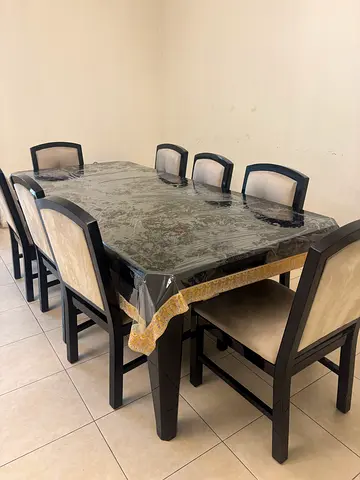 NEGOTIABLE - 8 seater dining table with cushioned chairs (excellent condition)