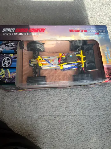 Remote control off-road racing buggy - light use in box
