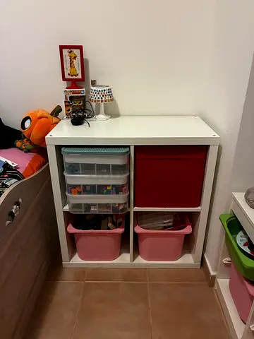 Kids toy storage unit with bins and assorted toys