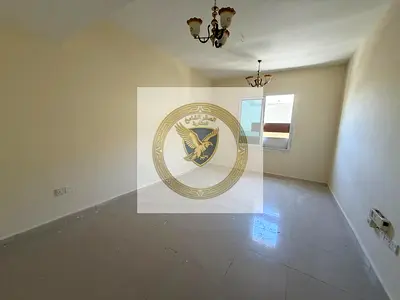 Apartment for annual rent - Al Qasimia. Spacious areas, open view, free maintenance, central air conditioning, prime location close to all services.