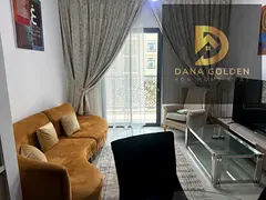 One bedroom and living room with pool view and balcony, furnished with hotel-style furniture, Maryam