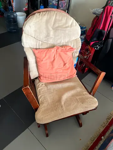 Solid Wooden rocking chair with cushions, used but in good condition and footer too