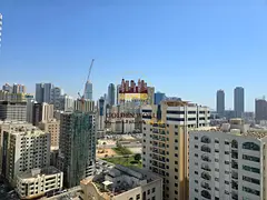 Luxury 3 Bedroom Apartment with Two Living Rooms, Balcony and Open Sea View in Al Majaz 3 with Free