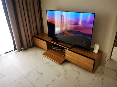 Low wooden TV stand in perfect condition 220 cms