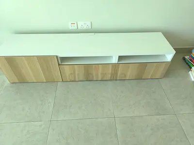 Low modern TV cabinet with storage — white top and wood finish