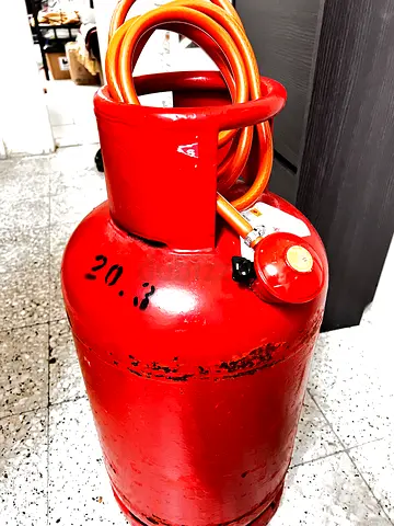 Large red 20kg Dubai LPG gas cylinder with half filled Gas regulator and hose - available for sale