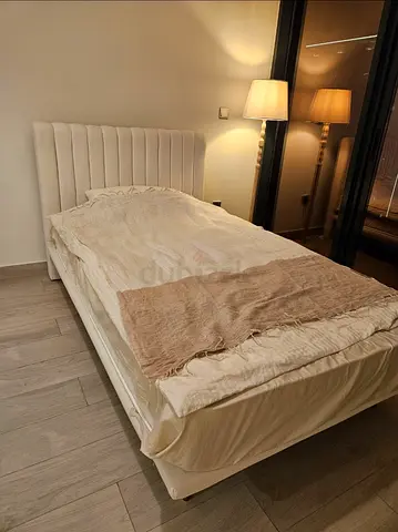 Bed with orthopedic mattress